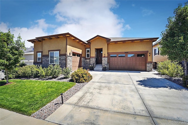 view of front facade with an attached garage, stone siding, driveway, and stucco siding