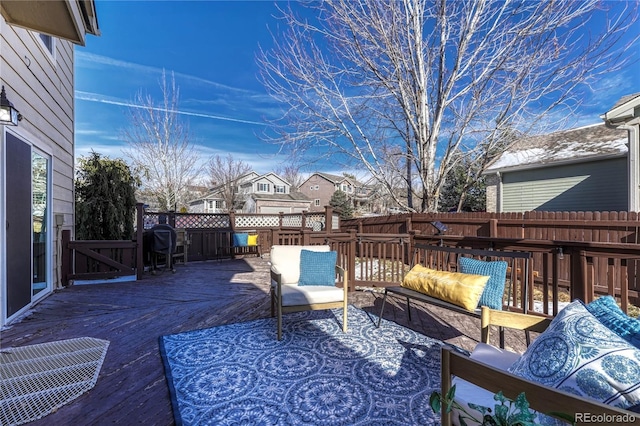 wooden deck with an outdoor living space