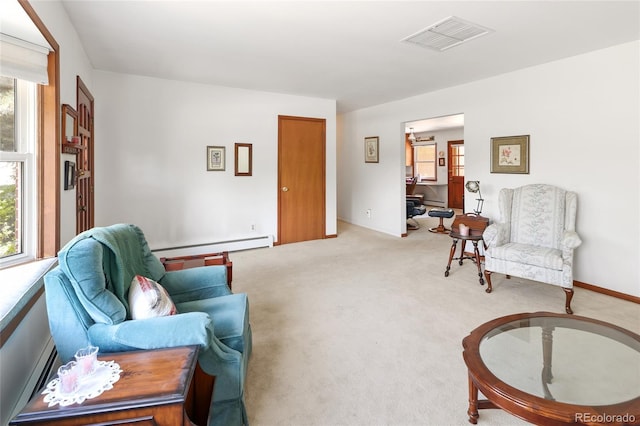 2900 S Golden Way, Denver, CO 80227 - carpeted living room featuring a baseboard radiator and plenty of natural light