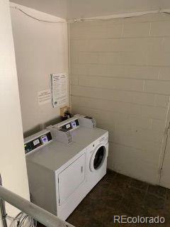 shared laundry area with washer and clothes dryer