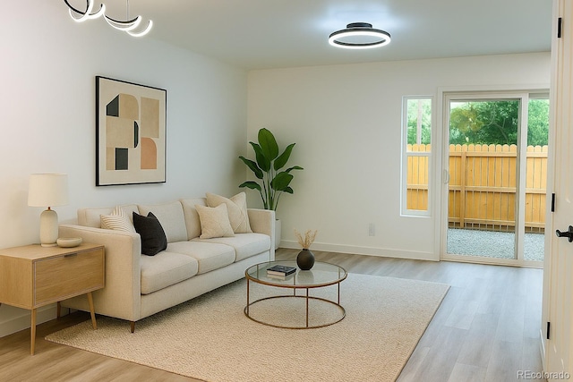 2218 Coronado Pkwy N Unit B, Denver, CO 80229 - living room with light wood-style floors and baseboards