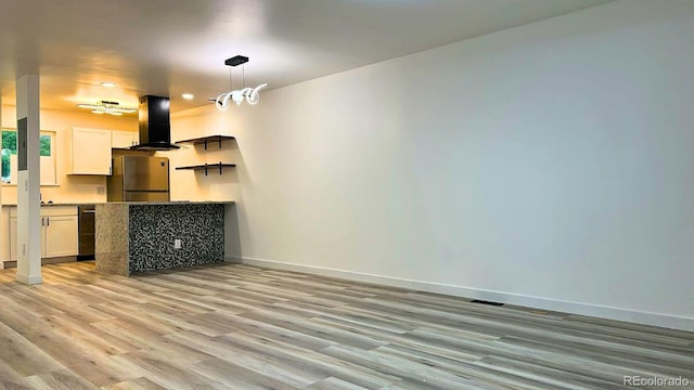 2218 Coronado Pkwy N Unit B, Denver, CO 80229 - unfurnished living room featuring light wood-type flooring and recessed lighting