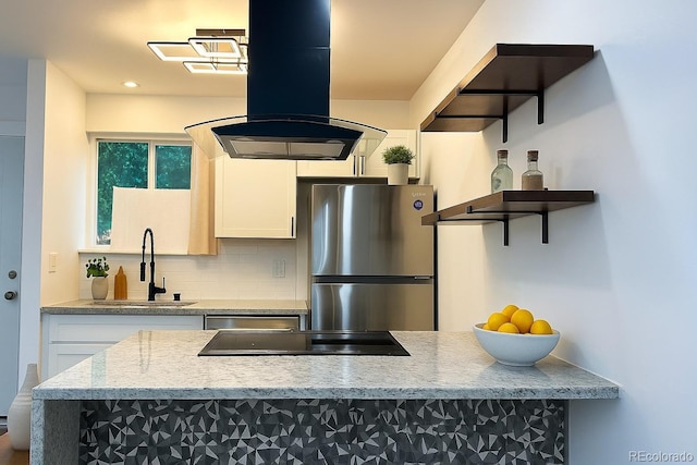 2218 Coronado Pkwy N Unit B, Denver, CO 80229 - kitchen with stainless steel appliances, ventilation hood, decorative backsplash, white cabinets, and light stone countertops