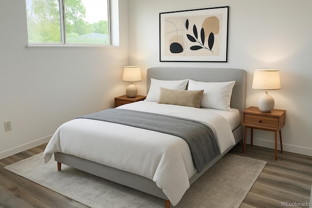2218 Coronado Pkwy N Unit B, Denver, CO 80229 - bedroom with baseboards and wood finished floors