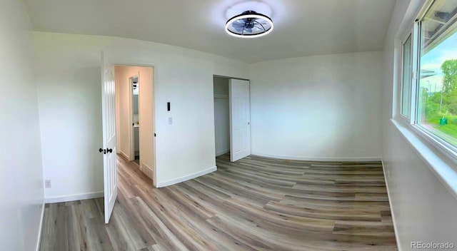 2218 Coronado Pkwy N Unit B, Denver, CO 80229 - spare room with wood finished floors and baseboards