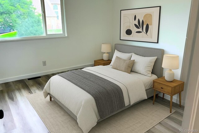 2218 Coronado Pkwy N Unit B, Denver, CO 80229 - bedroom featuring wood finished floors