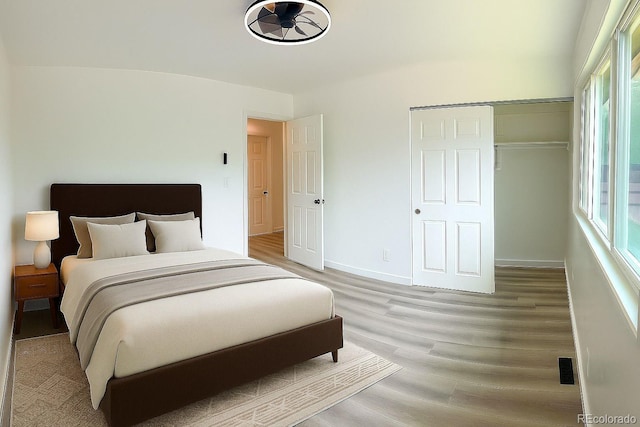 2218 Coronado Pkwy N Unit B, Denver, CO 80229 - bedroom with light wood-style floors and baseboards