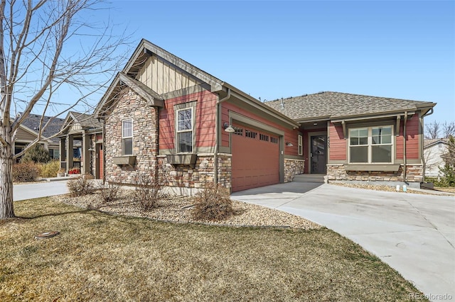 craftsman inspired home featuring board and batten siding, concrete driveway, roof with shingles, stone siding, and an attached garage