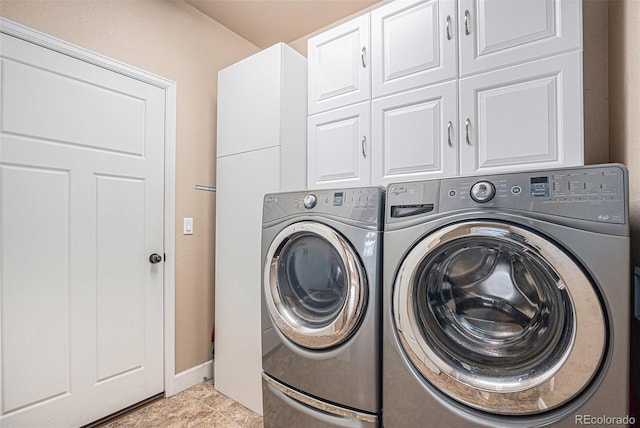 5521 Ensenada St, Denver, CO 80249 - laundry area featuring cabinet space, washer and dryer, and baseboards