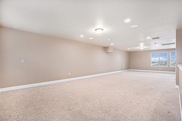 5521 Ensenada St, Denver, CO 80249 - spare room featuring baseboards, recessed lighting, and light colored carpet