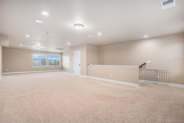 5521 Ensenada St, Denver, CO 80249 - spare room with light carpet, recessed lighting, and baseboards