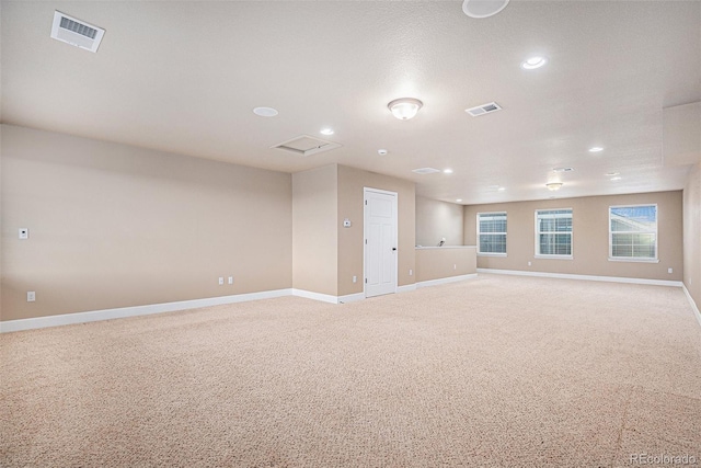 5521 Ensenada St, Denver, CO 80249 - empty room featuring baseboards, light carpet, and recessed lighting