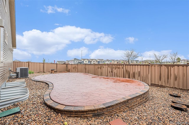 5521 Ensenada St, Denver, CO 80249 - fenced backyard featuring a patio area and cooling unit