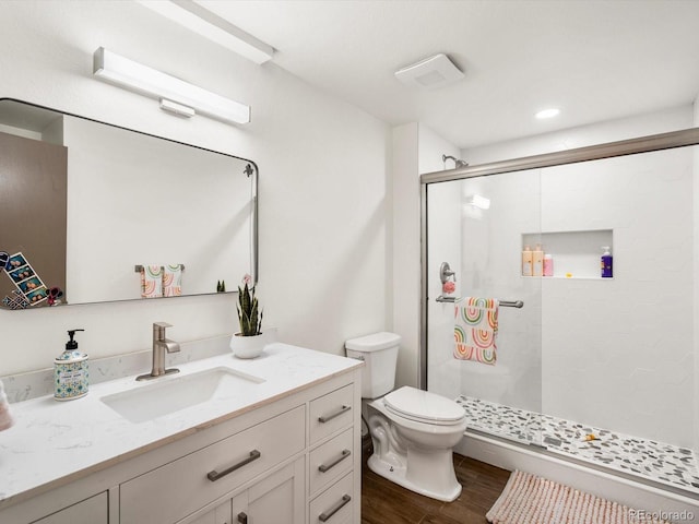 43 Falcon Hills Dr, Highlands Ranch, CO 80126 - full bath with vanity, a shower stall, toilet, and wood finished floors