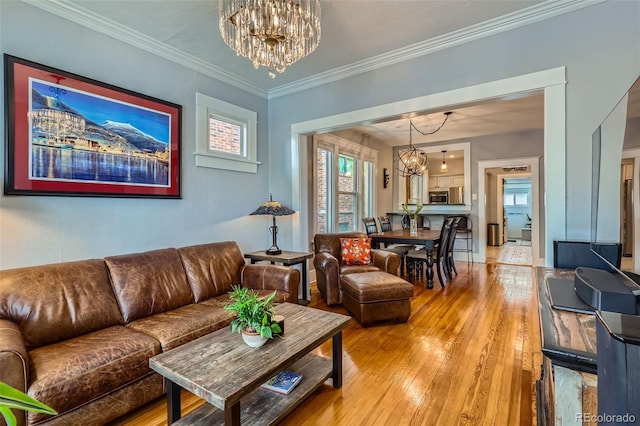 3259 Lowell Blvd, Denver, CO 80211 - living area featuring a chandelier, light wood-type flooring, and crown molding