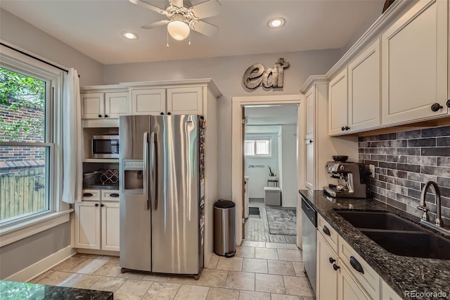 3259 Lowell Blvd, Denver, CO 80211 - kitchen with appliances with stainless steel finishes, backsplash, dark stone countertops, ceiling fan, and recessed lighting