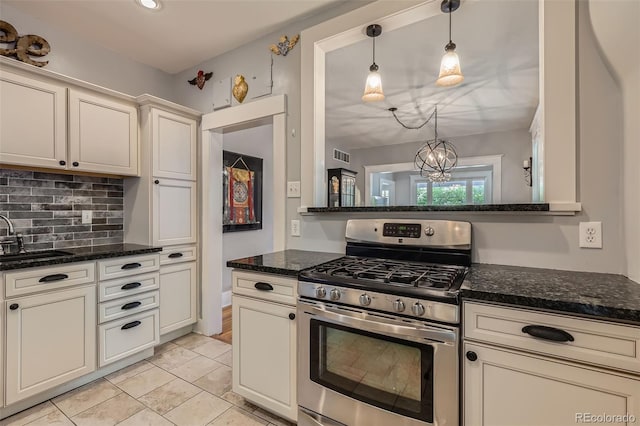 3259 Lowell Blvd, Denver, CO 80211 - kitchen featuring stainless steel range with gas cooktop, decorative backsplash, dark stone counters, pendant lighting, and a chandelier