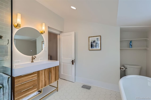 3259 Lowell Blvd, Denver, CO 80211 - full bathroom featuring a freestanding tub, vanity, tile patterned floors, and recessed lighting