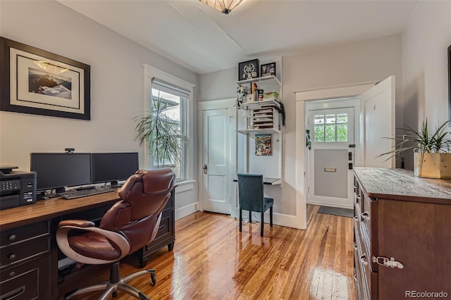 3259 Lowell Blvd, Denver, CO 80211 - home office featuring light wood-type flooring and healthy amount of natural light