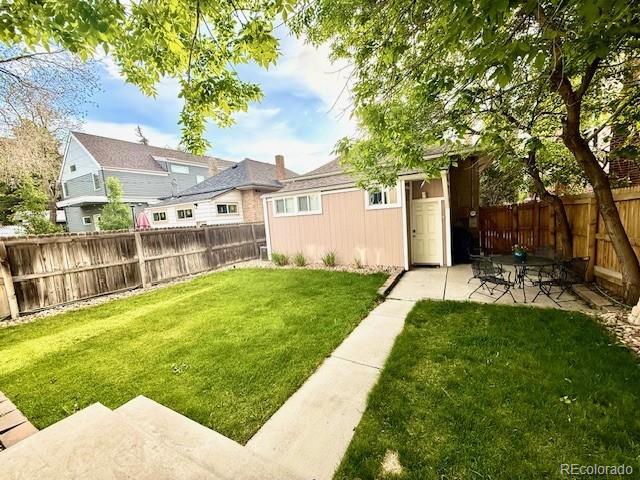 3259 Lowell Blvd, Denver, CO 80211 - fenced backyard featuring a patio area