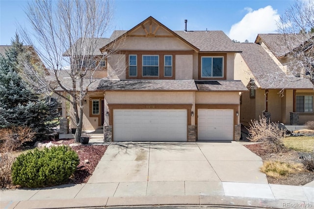 4454 College Park Ct, Colorado Springs, CO 80918 - view of front of property with an attached garage, stone siding, stucco siding, roof with shingles, and driveway