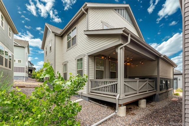 9723 Bennett Peak St, Littleton, CO 80125 - view of side of home featuring board and batten siding and a wooden deck