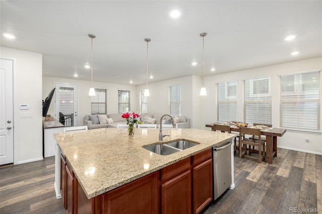 9723 Bennett Peak St, Littleton, CO 80125 - kitchen with a sink, stainless steel dishwasher, open floor plan, dark wood-type flooring, and recessed lighting
