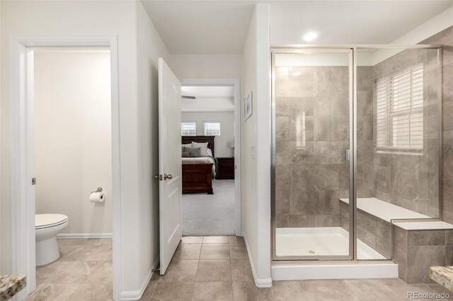 9723 Bennett Peak St, Littleton, CO 80125 - full bathroom with a shower stall, toilet, and baseboards