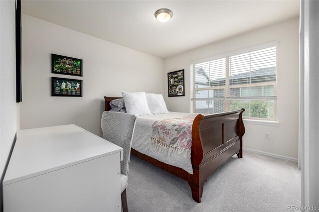 9723 Bennett Peak St, Littleton, CO 80125 - bedroom featuring baseboards and light carpet