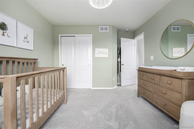 9723 Bennett Peak St, Littleton, CO 80125 - bedroom featuring light colored carpet, a closet, and baseboards