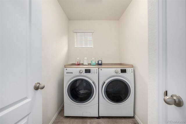 9723 Bennett Peak St, Littleton, CO 80125 - washroom featuring washer and dryer and baseboards
