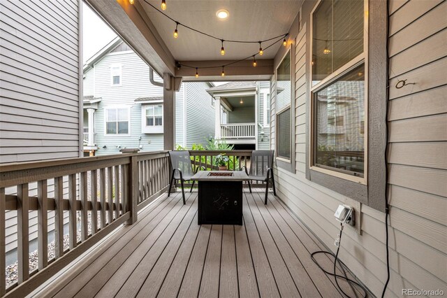 9723 Bennett Peak St, Littleton, CO 80125 - wooden terrace featuring a fire pit