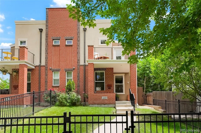 4414 Wolff St, Denver, CO 80212 - view of front of home featuring brick siding, a fenced front yard, and stucco siding