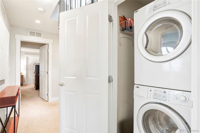 4414 Wolff St, Denver, CO 80212 - washroom featuring stacked washer / drying machine, light carpet, and recessed lighting