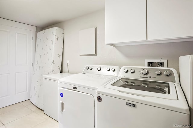 4414 Wolff St, Denver, CO 80212 - washroom with washer and dryer, cabinet space, and light tile patterned floors