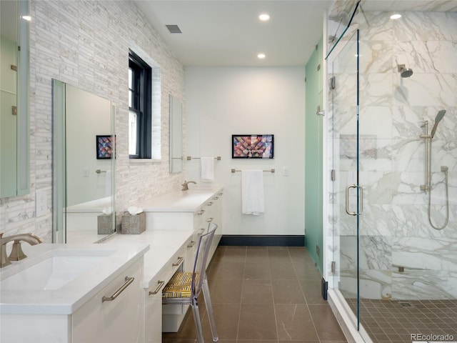 full bath with visible vents, tile patterned flooring, vanity, a marble finish shower, and recessed lighting