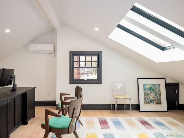 office space featuring an AC wall unit, light wood-style flooring, recessed lighting, baseboards, and lofted ceiling with skylight