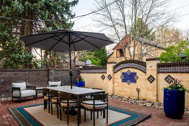 view of patio / terrace with fence and outdoor dining space