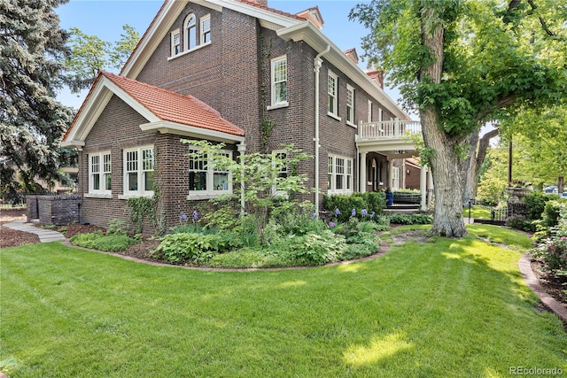 3309 E 7th Avenue Pkwy, Denver, CO 80206 - view of side of property with brick siding, a chimney, and a lawn