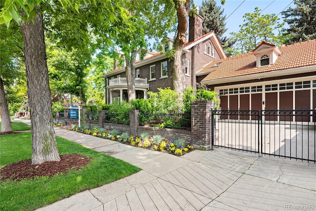 3309 E 7th Avenue Pkwy, Denver, CO 80206 - view of front of house with a tile roof, a garage, and brick siding
