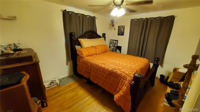 bedroom with ceiling fan and wood finished floors