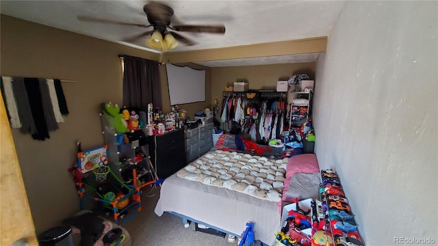 carpeted bedroom with a ceiling fan