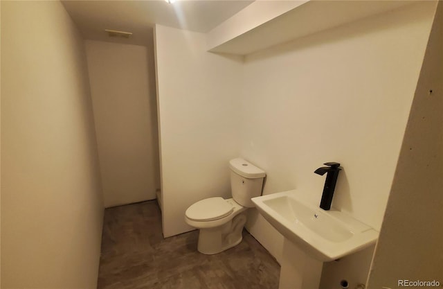 bathroom featuring toilet
