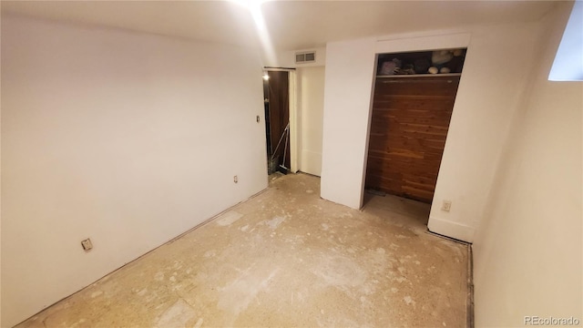 unfurnished bedroom featuring visible vents and a closet