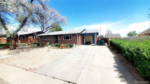 7620 Hooker St, Westminster, CO 80030 - ranch-style home with concrete driveway and brick siding