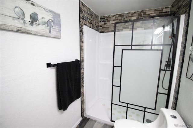 7620 Hooker St, Westminster, CO 80030 - bathroom featuring toilet, a shower stall, and wood finished floors