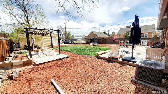 7620 Hooker St, Westminster, CO 80030 - view of yard featuring central air condition unit, an outdoor structure, a deck, and a pergola