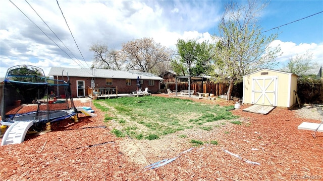 7620 Hooker St, Westminster, CO 80030 - fenced backyard with a trampoline