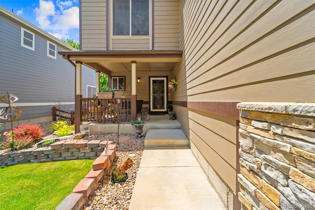 5975 S Walden Ct, Aurora, CO 80016 - view of exterior entry featuring a porch