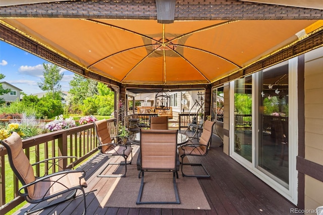 5975 S Walden Ct, Aurora, CO 80016 - wooden terrace with a gazebo and outdoor dining space